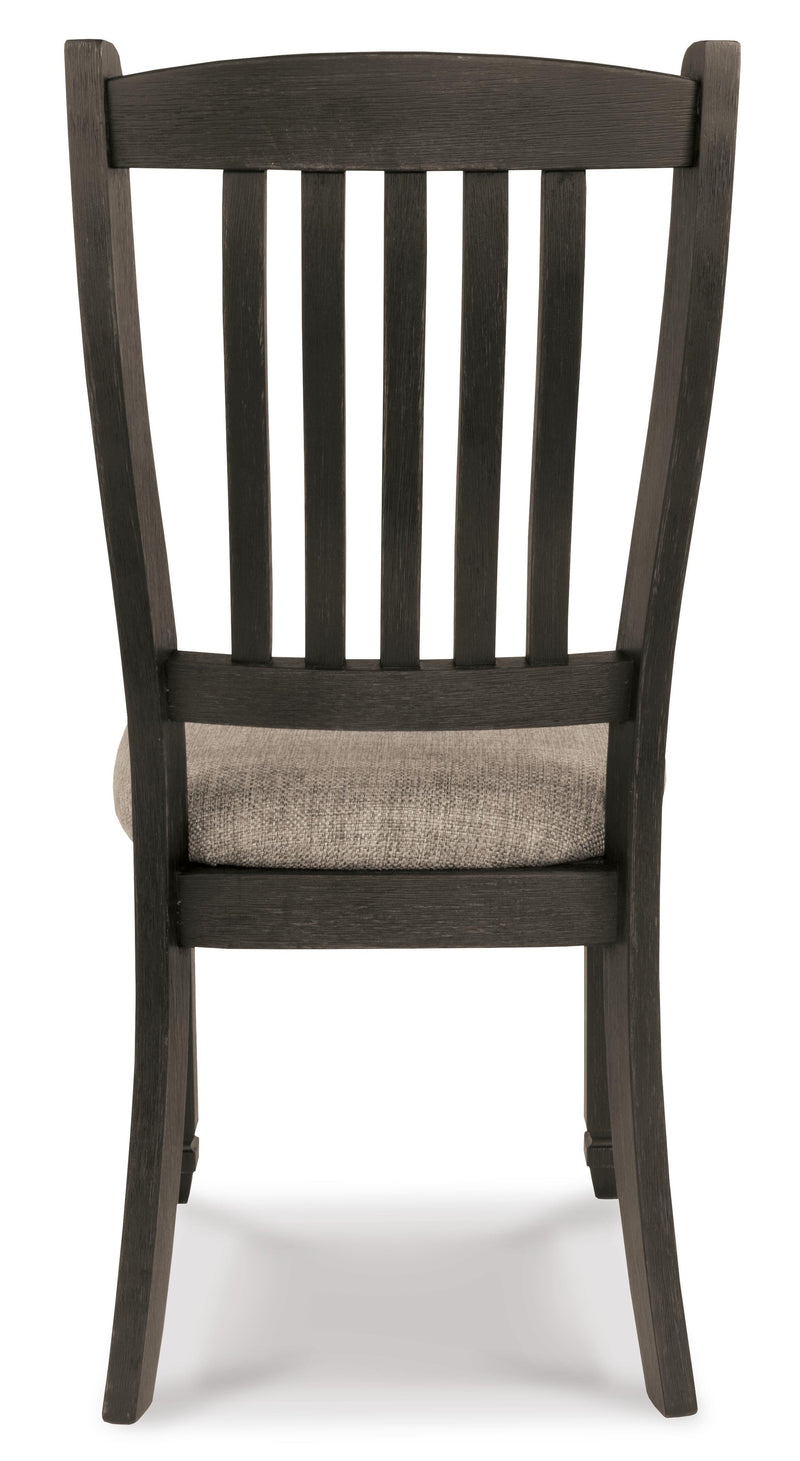 Ashley Furniture Tyler Creek dining room set with a rectangular table and six upholstered chairs, shown from the back.