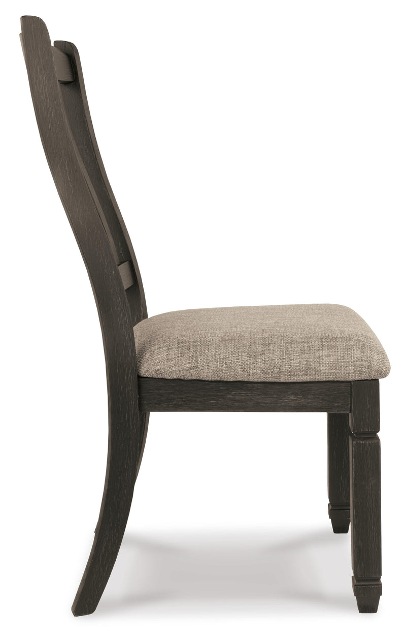 Ashley Furniture Tyler Creek dining room set with a table and chairs, shown from a side angle in a modern dining room.