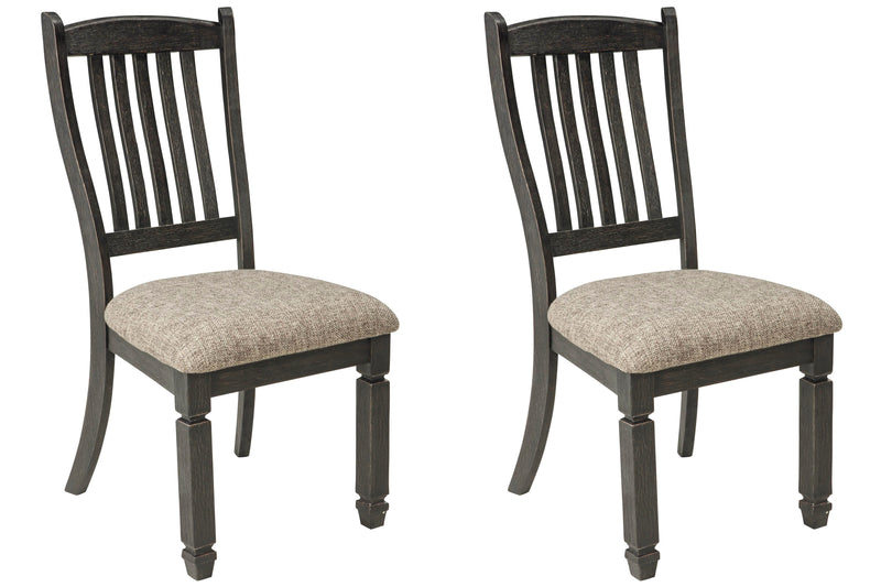 Ashley Furniture Tyler Creek dining chair set featuring four sturdy wooden chairs with upholstered seats and stylish design.