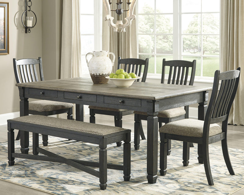 Ashley Furniture Tyler Creek Dining Set with rectangular table and six matching chairs in warm wood finish.