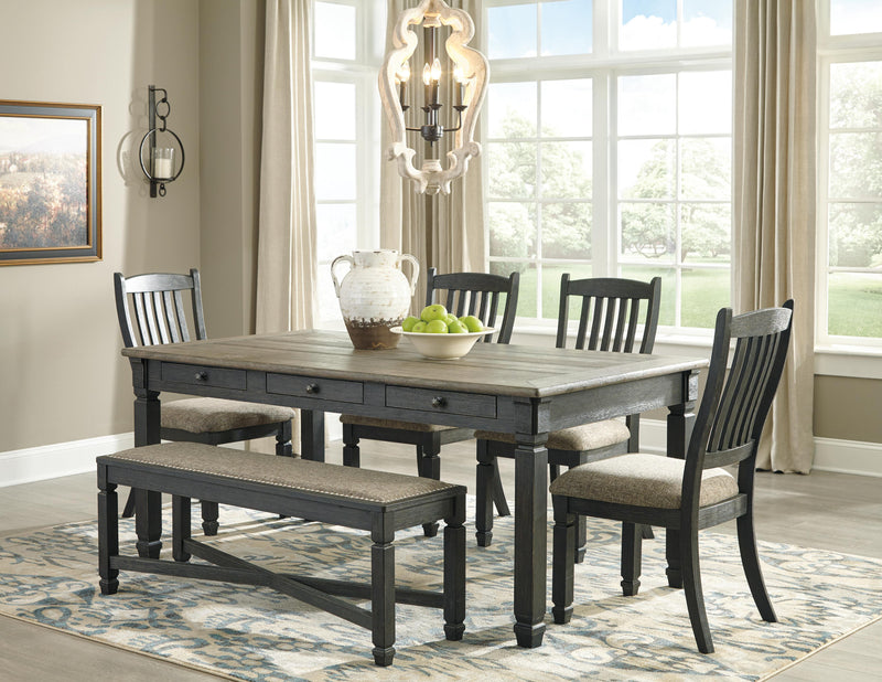 Ashley Furniture Tyler Creek dining room set with wooden table and six matching chairs arranged in a modern dining space.