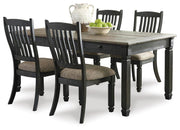 Ashley Furniture Tyler Creek Dining Set with a wooden table and matching chairs in a modern dining room setting.