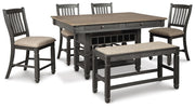 Ashley Furniture Tyler Creek counter height dining set with four chairs and a rectangular table in a warm wood finish.