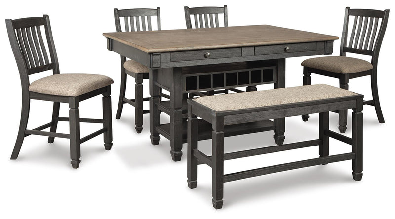 Ashley Furniture Tyler Creek counter height dining set with four chairs and a rectangular table in a warm wood finish.