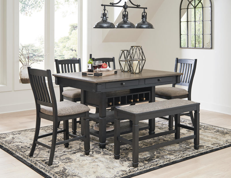 Ashley Furniture Tyler Creek counter height dining set with wooden table and matching chairs in a modern dining room.