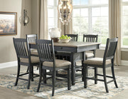 Ashley Furniture Tyler Creek counter height dining set with a wooden table and matching chairs in a modern dining room.