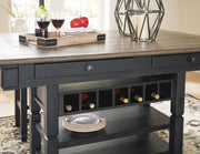 Ashley Furniture Tyler Creek counter height dining set with wine-colored chairs and detailed wood finish in a modern dining room setting.
