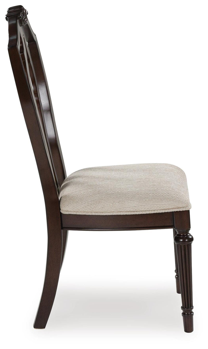 Ashley Furniture Lavinton dining chair with wooden legs and upholstered seat, shown from a side view.