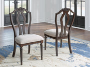 Ashley Furniture Lavinton dining chair with upholstered seat and wooden legs, shown from a side angle.