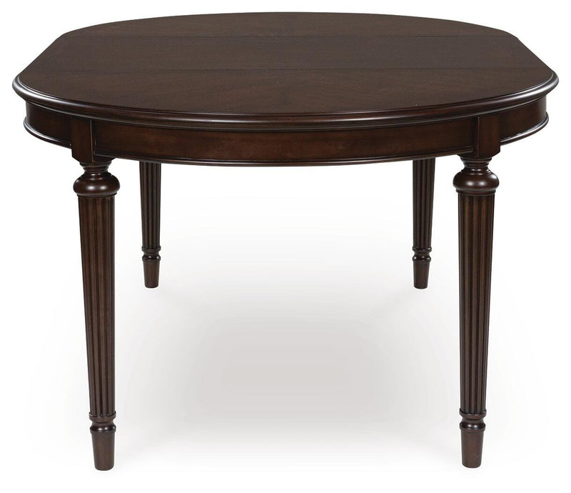 Ashley Furniture Lavinton Dining Extension Table with wooden surface and extendable design for versatile dining space.