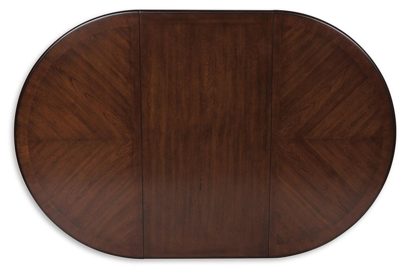 Ashley Furniture Lavinton dining extension table with a polished wood top and a leaf extension, ideal for flexible dining spaces.