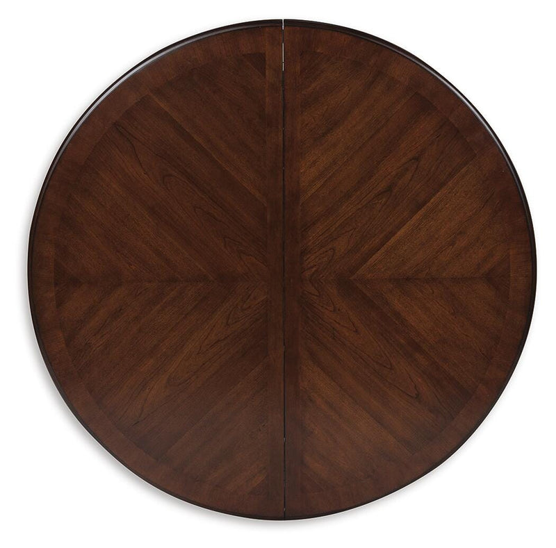 Ashley Furniture Lavinton dining extension table with wood finish and leaf extension, shown with the table top and leaf in place.