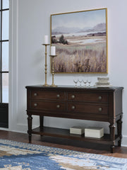 Ashley Furniture Lavinton dining server with wood finish, featuring multiple storage drawers and cabinet space for dining room organization.