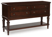 Ashley Furniture Lavinton dining server with closed cabinet doors, showcasing elegant wood finish and storage compartments.