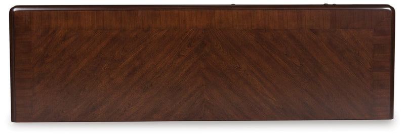 Ashley Furniture Lavinton dining server with a polished wooden top and elegant storage compartments.