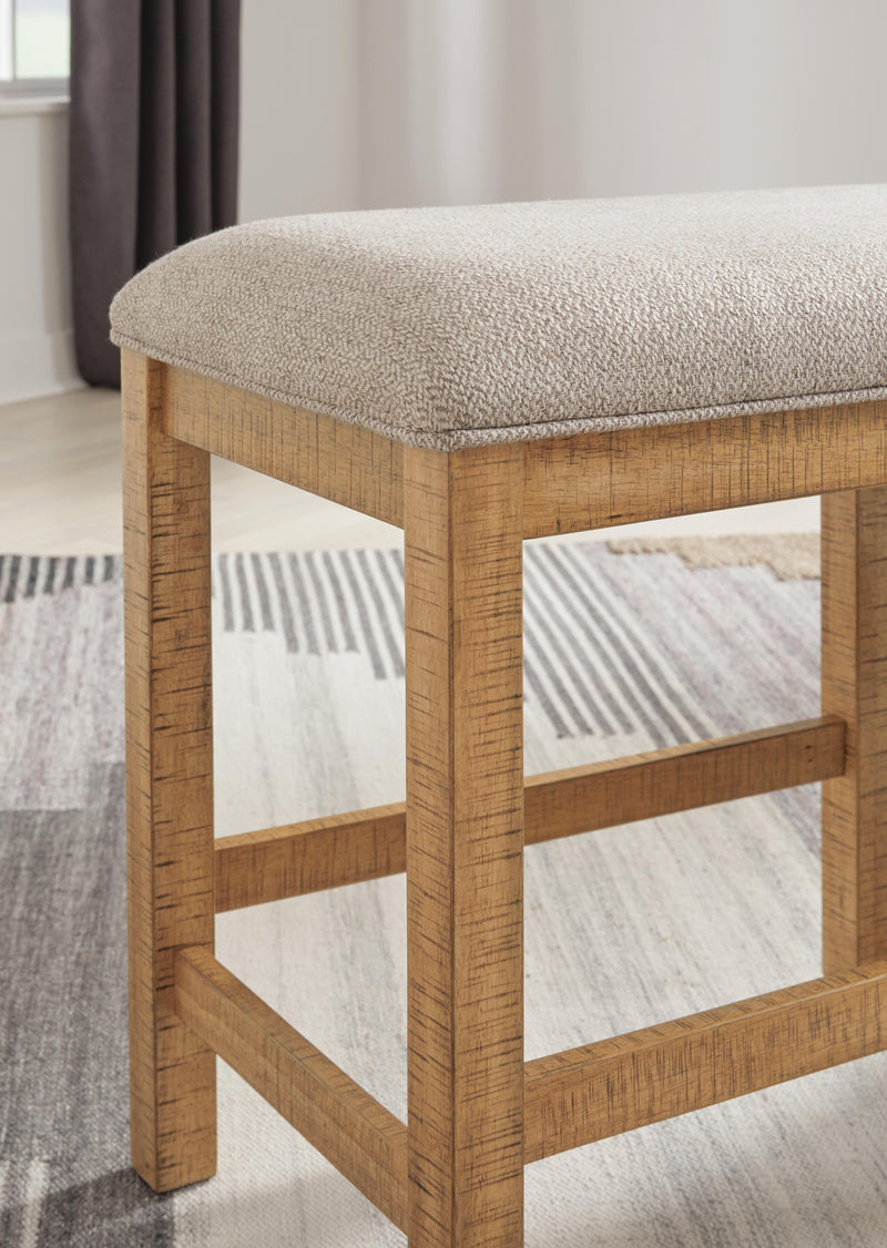 Ashley Furniture Havonplane 72-inch counter height dining bench with wooden legs and upholstered seat for modern dining spaces.