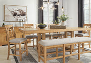 Havonplane 72-inch counter height dining bench by Ashley Furniture with wooden legs and upholstered seat in a modern dining room setting.