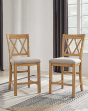 Ashley Furniture Havonplane counter height barstool with wooden legs and a cushioned seat, shown in a modern kitchen setting.