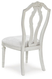 Ashley Furniture Montelaine dining chair with upholstered back and wooden frame, shown from the rear.