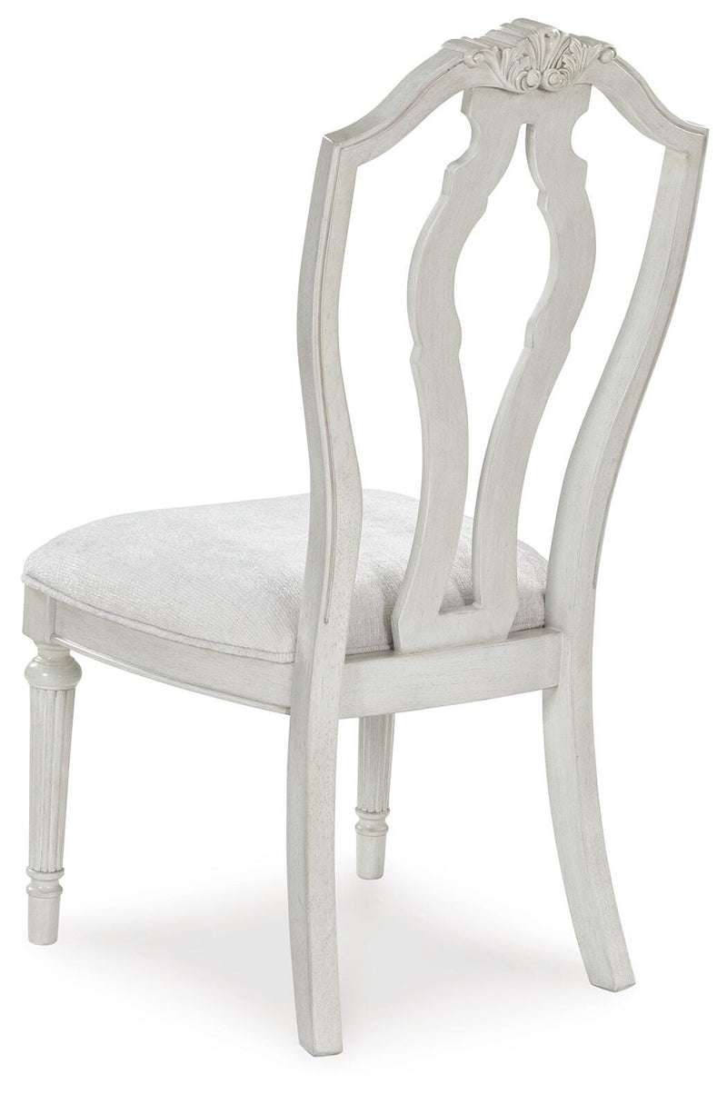 Ashley Furniture Montelaine dining chair with upholstered back and wooden frame, shown from the rear.