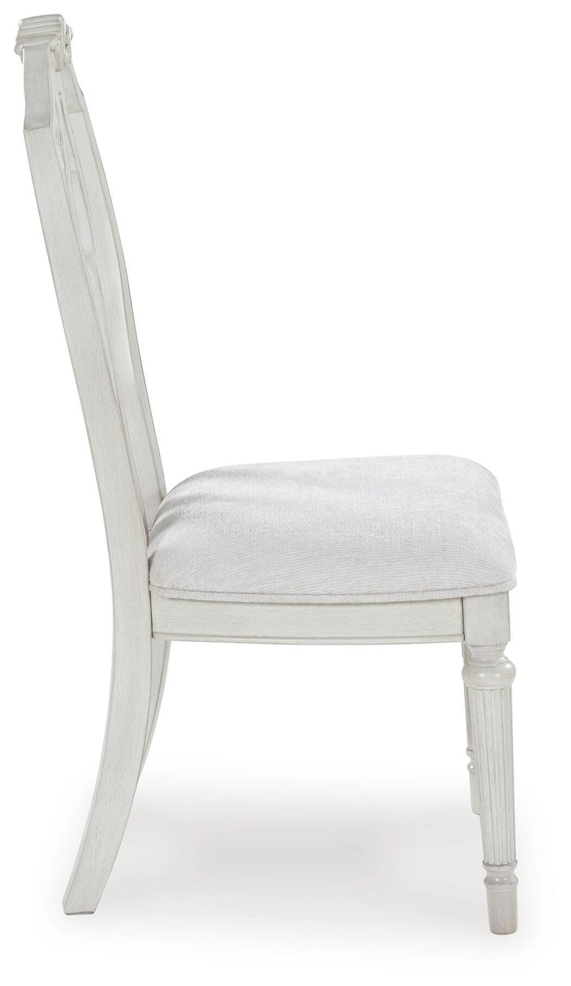 Ashley Furniture Montelaine dining chair with beige upholstered seat and wooden legs, shown from a side view.