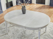 Ashley Furniture Montelaine dining room set with formal seating, featuring a detailed view of the table and chairs.