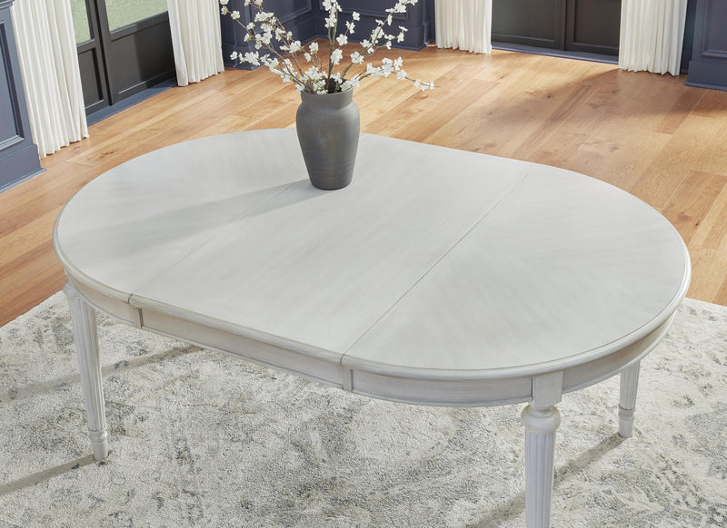 Ashley Furniture Montelaine dining room set with formal seating, featuring a detailed view of the table and chairs.