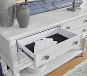 Ashley Furniture Montelaine dining server with dark wood finish and elegant storage compartments, detailed in the image.