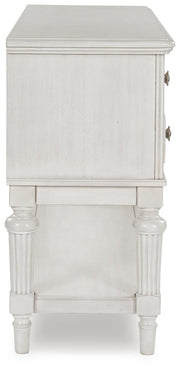 Montelaine dining server by Ashley Furniture, showcasing a stylish wooden server with drawers and shelves for dining room storage.