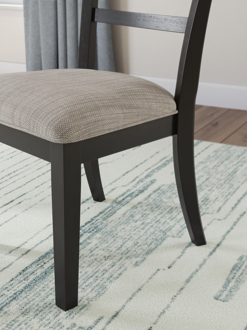 Detail of the Ashley Furniture Greddinton dining room set showing the wooden table and matching chairs with elegant design.