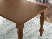 Ashley Furniture Greddinton dining room set featuring a wooden table and matching chairs with elegant upholstery and detailed design.