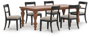 Ashley Furniture Greddinton dining room set with a wooden table and matching chairs, styled for a modern dining space.
