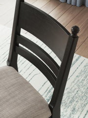 Ashley Furniture Greddinton dining room set with a wooden table and six upholstered chairs, shown in a well-lit dining space.