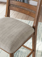 Ashley Furniture Greddinton dining room set with a rectangular table and six upholstered chairs, detailed view of the wood finish and design.