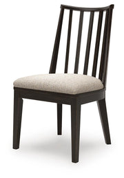 Ashley Furniture Galliden dining room set with a wooden table and matching chairs, shown from an angled side view.