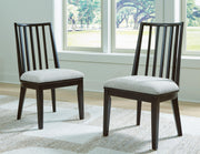 Ashley Furniture Galliden dining room set with a wooden table and six matching chairs in a modern dining space.