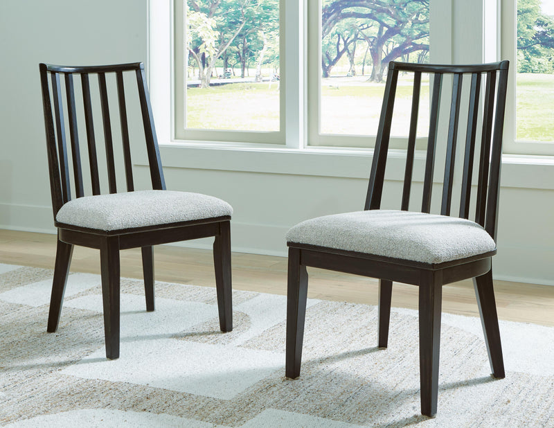 Ashley Furniture Galliden dining room set with a wooden table and six matching chairs in a modern dining space.