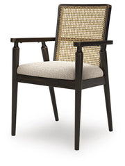 Ashley Furniture Galliden dining room set with a wooden table and matching chairs, shown from an angled side view.
