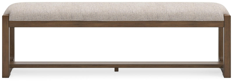 Ashley Furniture Cabalynn 63-inch wooden dining bench with a cushioned seat and elegant design, ideal for kitchen or dining room.