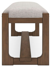 Cabalynn 63-inch wooden dining bench by Ashley Furniture, showing the side view with a warm wood finish and sturdy construction.