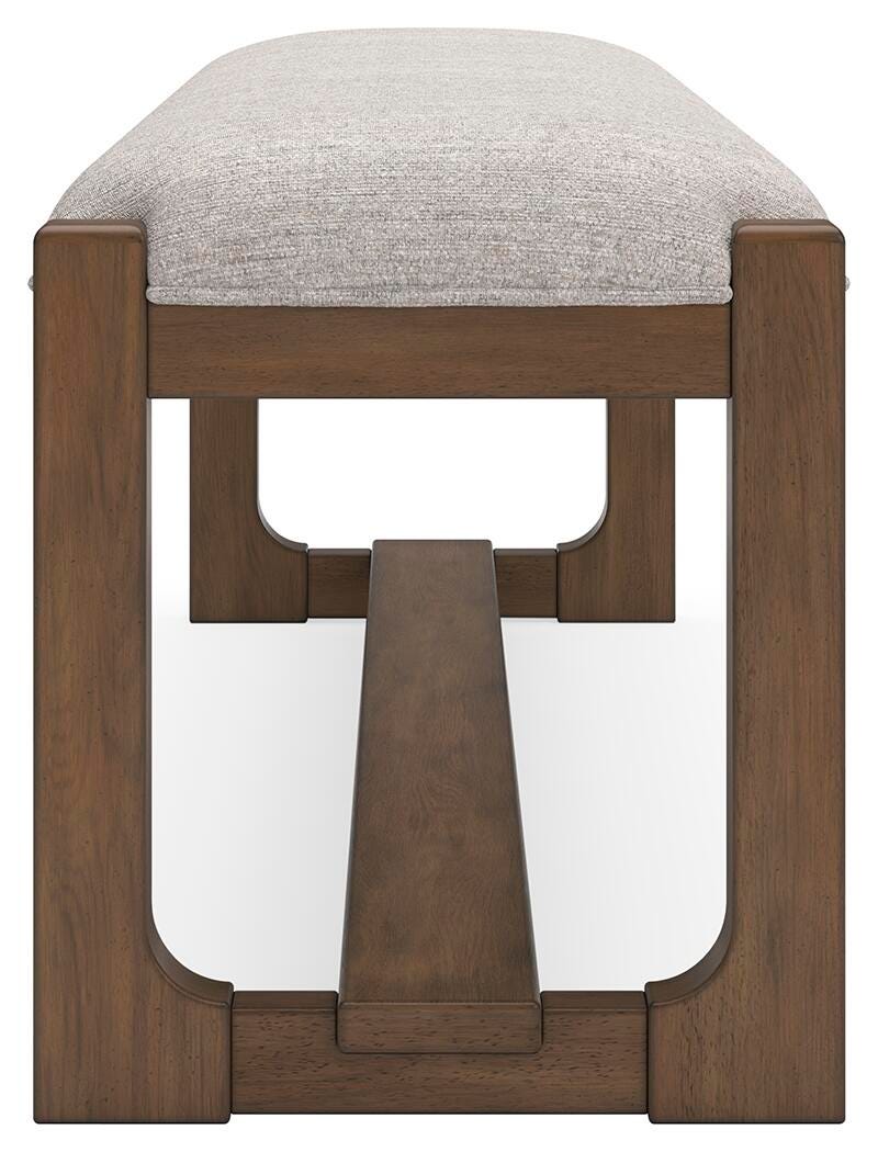Cabalynn 63-inch wooden dining bench by Ashley Furniture, showing the side view with a warm wood finish and sturdy construction.