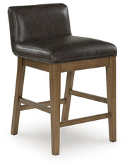 Ashley Furniture Cabalynn counter height barstool with wooden legs and upholstered seat, shown from an angled side view.