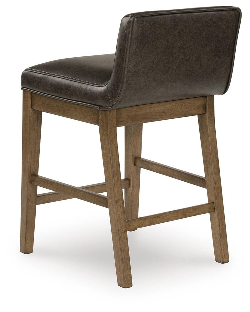 Ashley Furniture Cabalynn counter height barstool with a backrest, shown from a back angle with dark wood finish and upholstered seat.