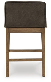 Ashley Furniture Cabalynn counter height barstool with a padded backrest and wooden legs, shown from the back.