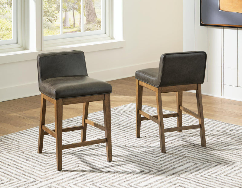 Ashley Furniture Cabalynn counter height barstool with wooden legs and upholstered seat, shown from front view.