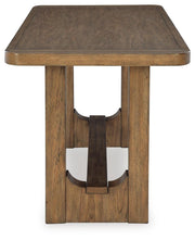 Ashley Furniture Cabalynn counter height dining table with a dark wood finish, shown from the side view.