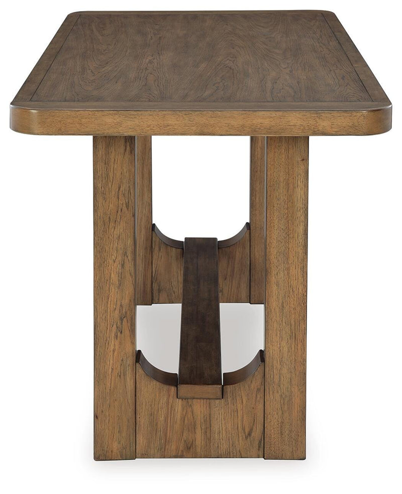 Ashley Furniture Cabalynn counter height dining table with a dark wood finish, shown from the side view.