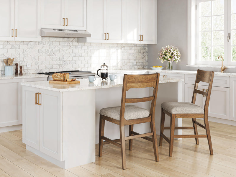 Ashley Furniture Cabalynn counter height barstool with wooden legs and a cushioned seat, shown from the side.
