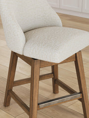 Cabalynn Ashley Furniture counter height barstool with wooden legs and upholstered seat, shown from detailed angle.