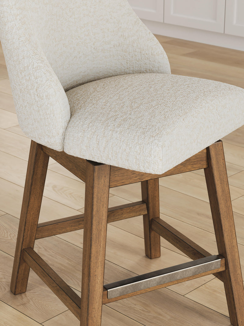 Cabalynn Ashley Furniture counter height barstool with wooden legs and upholstered seat, shown from detailed angle.
